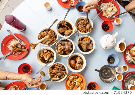 People eating variety of authentic bak kut teh, popular Chinese food in Klang, Malaysia People eating variety of authentic bak kut teh, popular Chinese food in Klang, Malaysia 71954370