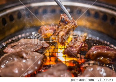 Delicious meat grilled over charcoal 71957964