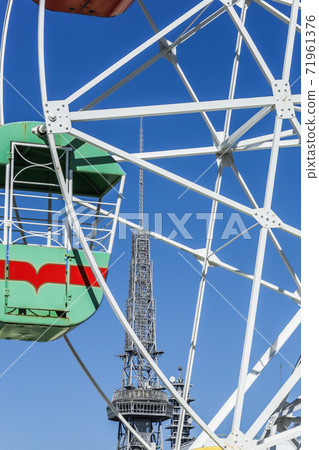Japan's oldest rooftop Ferris wheel with the Nagoya TV Tower in the background Japan's oldest rooftop Ferris wheel with the Nagoya TV Tower in the background 71961376