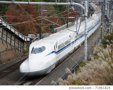 Shinkansen N700S J5 formation and autumn leaves near Ishiyama, Otsu City 71961828