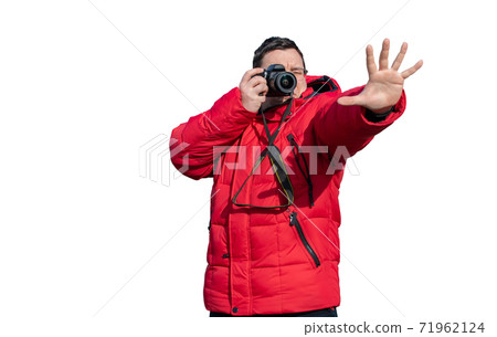 the guy takes photos and holds his hand in front of him 71962124