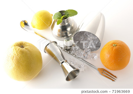 Make a cocktail with a shaker using grapefruit, orange, lemon and mint (white background) Make a cocktail with a shaker using grapefruit, orange, lemon and mint (white background) 71963669