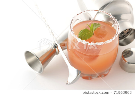 Photographed pink salty dog and cocktail shaker on a white background 71963963