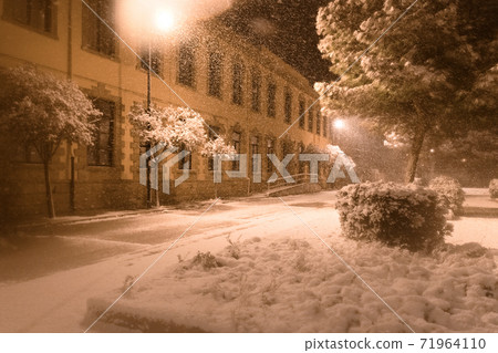 The street of Avetrana town under the snow after an unusual snowfall in Puglia, Salento 71964110