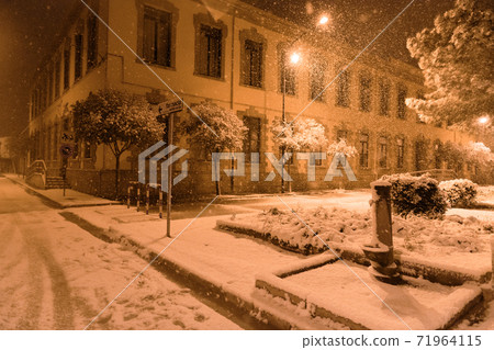 The street of Avetrana town under the snow after an unusual snowfall in Puglia, Salento 71964115