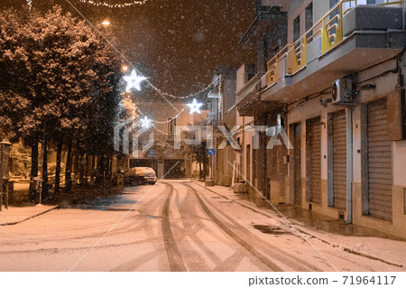 The street of Avetrana town under the snow after an unusual snowfall in Puglia, Salento 71964117