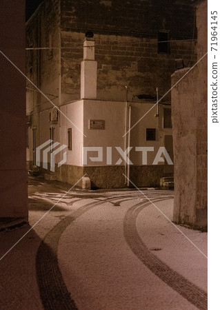 The street of Avetrana town under the snow after an unusual snowfall in Puglia, Salento 71964145
