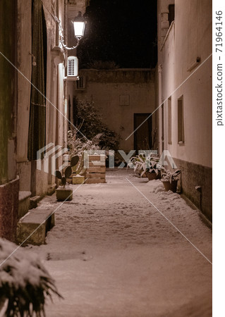 The street of Avetrana town under the snow after an unusual snowfall in Puglia, Salento 71964146
