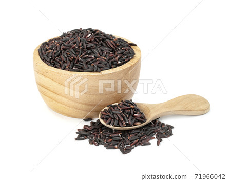 dark violet rice berry with wooden bowl and spoon isolated on white background dark violet rice berry with wooden bowl and spoon isolated on white background 71966042