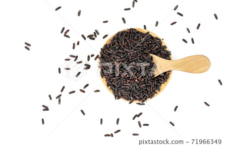 dark violet rice berry with wooden bowl and spoon isolated on white background 71966349