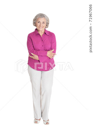 Beautiful senior woman posing isolated on white background Beautiful senior woman posing isolated on white background 71967066