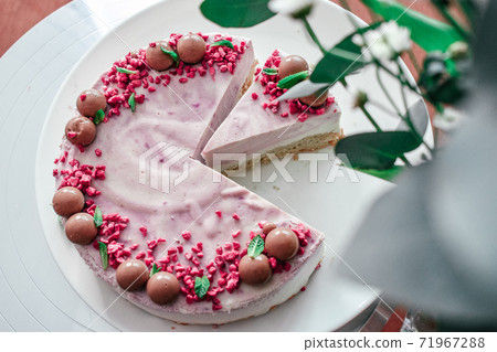 Raw vegan strawberry cake decorated with choco. berry filling jelly vegetarian cashew cream cheesecake gluten free. Lactose sugar free holiday birthday desert. Indoor photo Raw vegan strawberry cake decorated with choco. berry filling jelly vegetarian cashew cream cheesecake gluten free. Lactose sugar free holiday birthday desert. Indoor photo 71967288