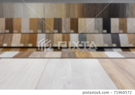 blurred and defocused: wide selection of hardware store with samples of wooden parquet for the floor 71968572
