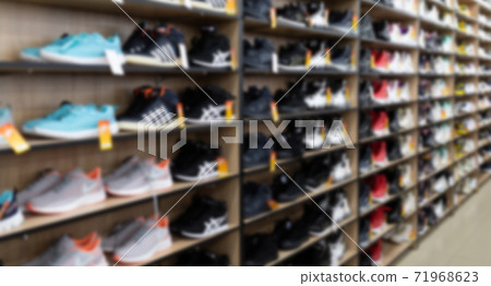 leather shoe store with a wide selection of colors, models and sizes, blurred and defocused leather shoe store with a wide selection of colors, models and sizes, blurred and defocused 71968623