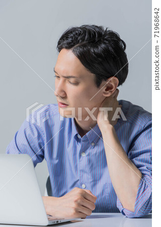 A young man frowning after failing at work A young man frowning after failing at work 71968642