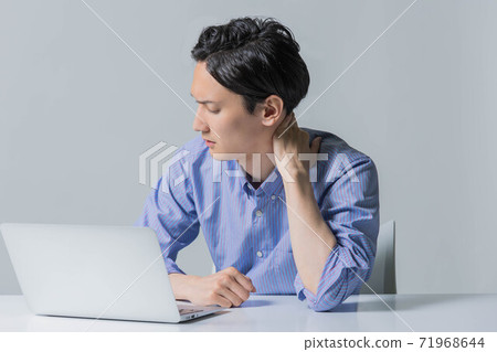 A young man frowning after failing at work A young man frowning after failing at work 71968644