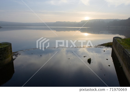 Sunset landscape at redmires reservoirs near sheffield. Hazy evening Sunset landscape at redmires reservoirs near sheffield. Hazy evening 71970069