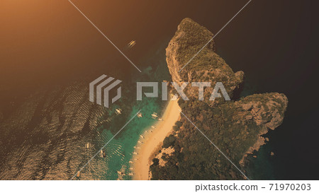 Sunset top down of hilly tropical island at ocean gulf in aerial view. Amazing sun set light 71970203