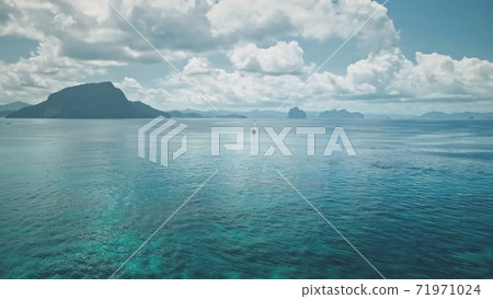 Serene blue water with mountainous islets of El Nido, Philippines, Asia. Panorama seascape Serene blue water with mountainous islets of El Nido, Philippines, Asia. Panorama seascape 71971024