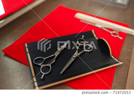 Hairdresser equipment, top view, red background Hairdresser equipment, top view, red background 71972053