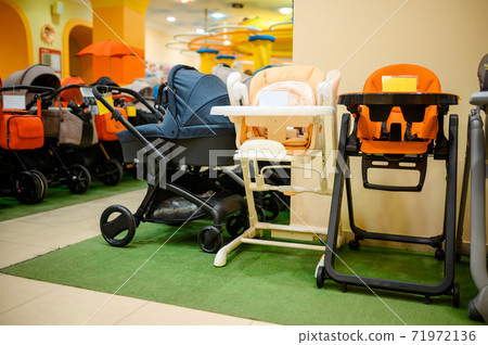 Baby strollers assortment in children's store Baby strollers assortment in children's store 71972136