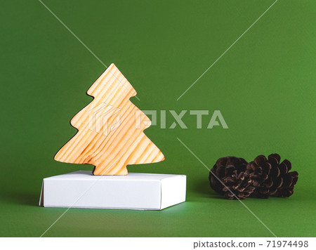 The new year concept as a background of the wooden conifer tree with strobiles. 71974498