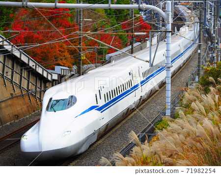 Shinkansen N700S J5 formation and autumn leaves near Ishiyama, Otsu City 71982254