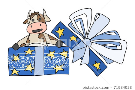 funny bull climbs out of a festive blue gift. new 71984038