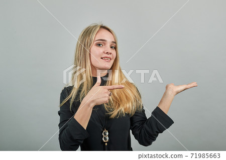 Shows direction of hands, demonstrates product, represents an imaginary output Shows direction of hands, demonstrates product, represents an imaginary output 71985663