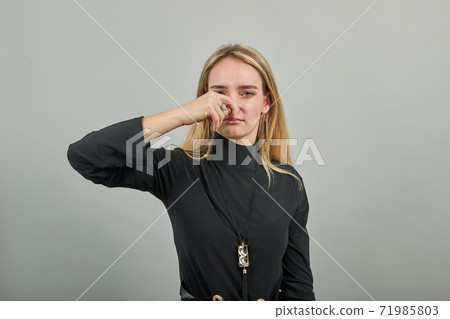 Covering nose with hand showing something stinks, hands face against, staring Covering nose with hand showing something stinks, hands face against, staring 71985803