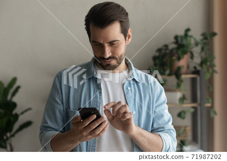 Young man use smartphone browsing internet on gadget Young man use smartphone browsing internet on gadget 71987202