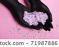 Flavored, odorous salt for spa and bath. Salt on a female hand. Natural crystallized product from the sea 71987886