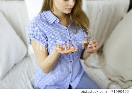 Beautician doing beauty procedure with syringe to face of young brunette woman in sunny spa center. Cosmetic medicine and surgery, beauty injections Beautician doing beauty procedure with syringe to face of young brunette woman in sunny spa center. Cosmetic medicine and surgery, beauty injections 71990493