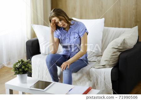 Happy blond woman put hands behind head sitting leaned on couch caucasian female enjoy lazy weekend or vacation in cozy living room, housewife relaxing feels satisfied accomplish chores housework 71990506