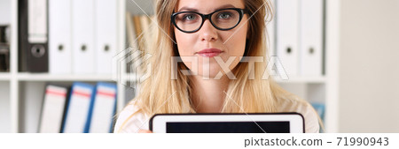 Portrait of cute woman that showing her tablet Portrait of cute woman that showing her tablet 71990943