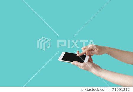 Women handling smartphone Women handling smartphone 71991212