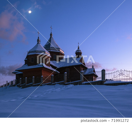 Night countryside hills, groves and farmlands in winter remote alpine mountain village. Ukraine, Voronenko. Night countryside hills, groves and farmlands in winter remote alpine mountain village. Ukraine, Voronenko. 71991272