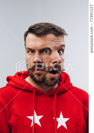 Young man with dual emotions combination on face isolated on white background, emotional and expressive Young man with dual emotions combination on face isolated on white background, emotional and expressive 71991527