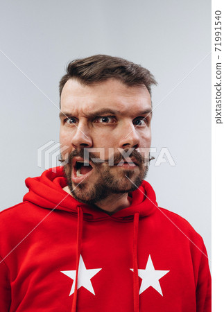 Young man with dual emotions combination on face isolated on white background, emotional and expressive Young man with dual emotions combination on face isolated on white background, emotional and expressive 71991540