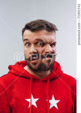 Young man with dual emotions combination on face isolated on white background, emotional and expressive Young man with dual emotions combination on face isolated on white background, emotional and expressive 71991542