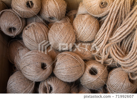 Spools or rolls of brown color linen string 71992607