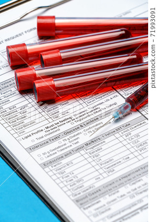 Clipboard with paper blank form with blood test tubes on blue background 71993091