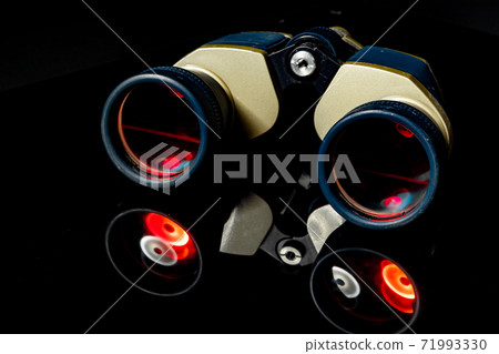 Military binoculars on black background close up 71993330
