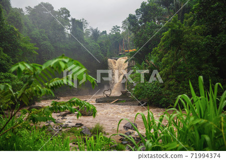 Muddy waters of a Tegenungan waterfall Muddy waters of a Tegenungan waterfall 71994374