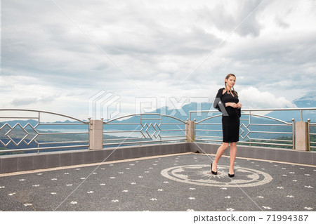 Lovely woman wearing in black dress 71994387