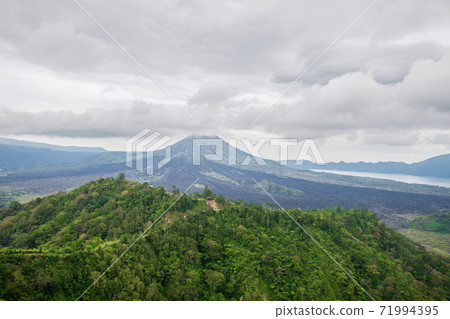 View of the volcano Batur and the jungle View of the volcano Batur and the jungle 71994395