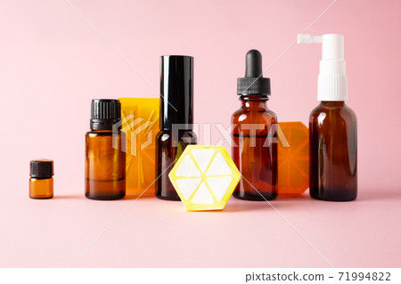 Essential oils, various bottles aromatherapy on a pink background. Aromatherapy and perfumes concept 71994822