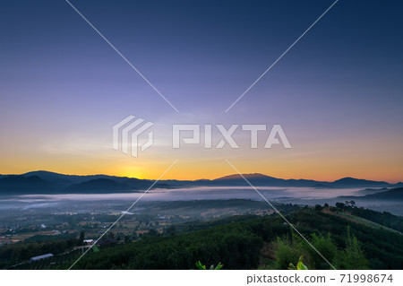 Sunrise and sea of clouds over Pai District at sunrise from Yun Lai Viewpoint. Sunrise and sea of clouds over Pai District at sunrise from Yun Lai Viewpoint. 71998674