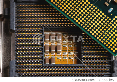 Blank cpu cpu socket with pins on motherboard in yellow color close-up Blank cpu cpu socket with pins on motherboard in yellow color close-up 72000169