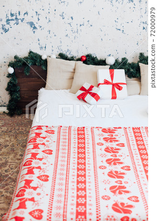 Christmas bedroom interior with bed Christmas tree presents new year as background 72000979